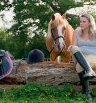 A teenage girl with her pony